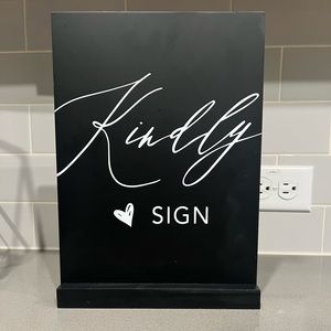 “Kindly Sign” black sign